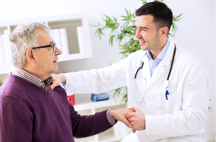 A doctor reassuring an older patient